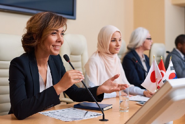 female-speaker-at-a-global-event female-speaker-at-a-global-event