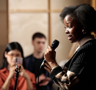 woman-speaking-at-seminar woman-speaking-at-seminar
